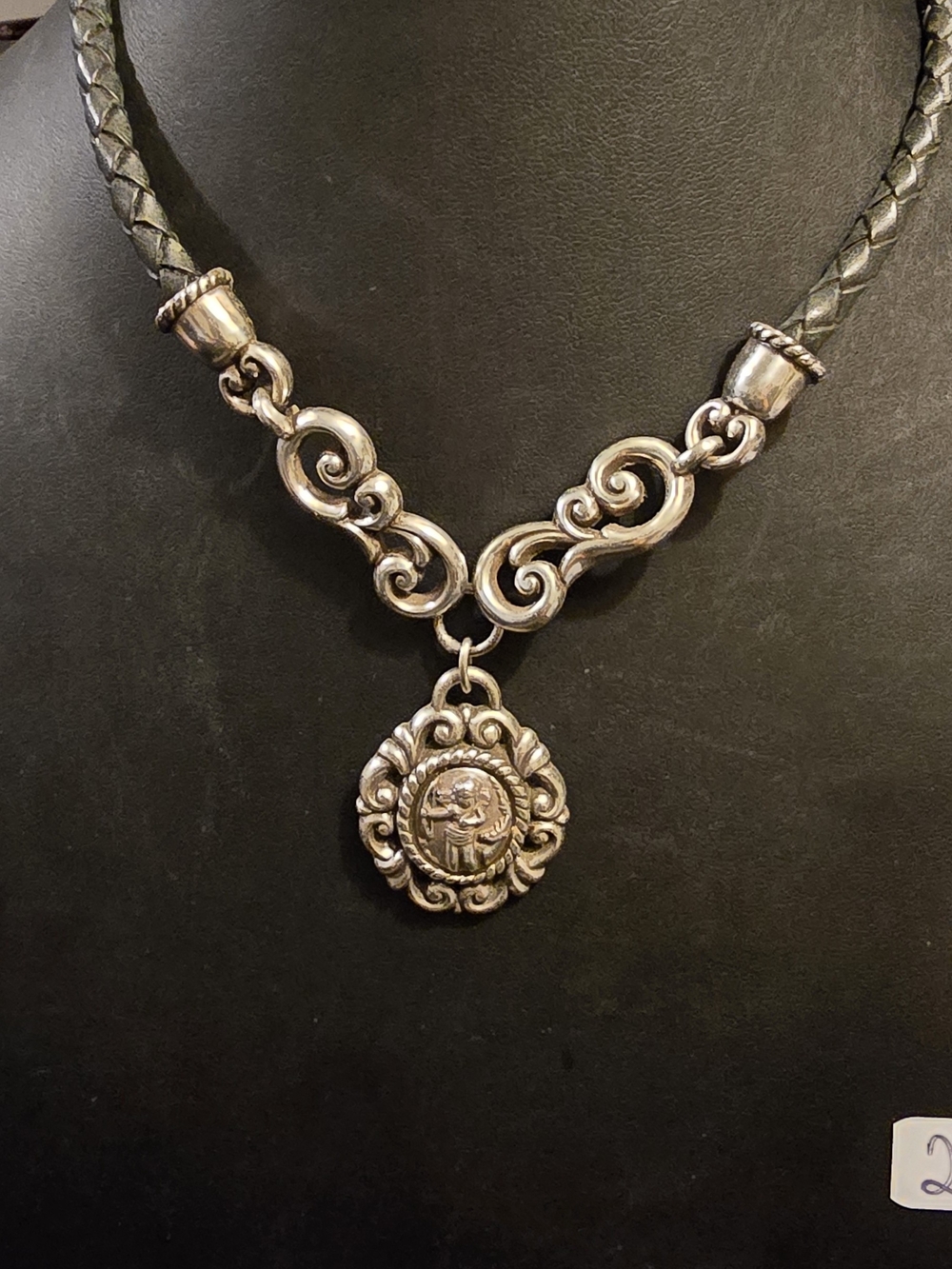 Rare vintage Brighton heavy leather cord necklace with an ornate silver Cupid pe